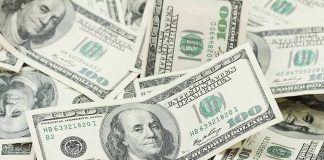Multiple US one hundred dollar bills