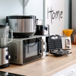 Kitchen appliances on a wooden countertop in kitchen