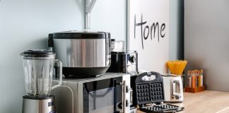 Kitchen appliances on a wooden countertop in kitchen