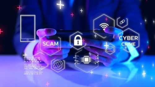 internet scam_2122606175 featured image Person using smartphone with digital security icons displayed