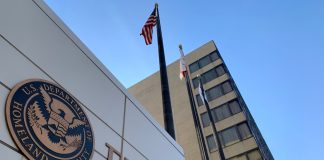 FEMA building with flags and blue sky backdrop