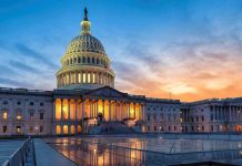 US Capitol building illuminated at sunset