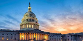 US Capitol building illuminated at sunset