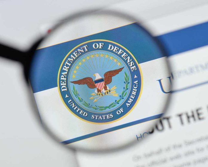 1170026380 Magnifying glass over Department of Defense logo.