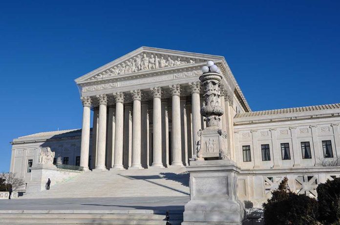 shutterstock_106535648.jpg The Supreme Court building with large columns and a clear blue sky