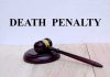 Gavel with Death Penalty text background.