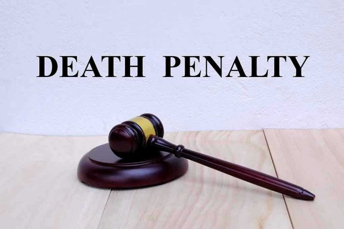 1218842989 Gavel with Death Penalty text background.