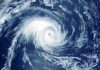 Hurricane CHAOS: 25,000 Tourists Trapped! Satellite image of a swirling hurricane over ocean.