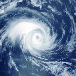Frightening Hurricane Approaches—Millions Brace for IMPACT! Satellite image of a swirling hurricane over ocean.