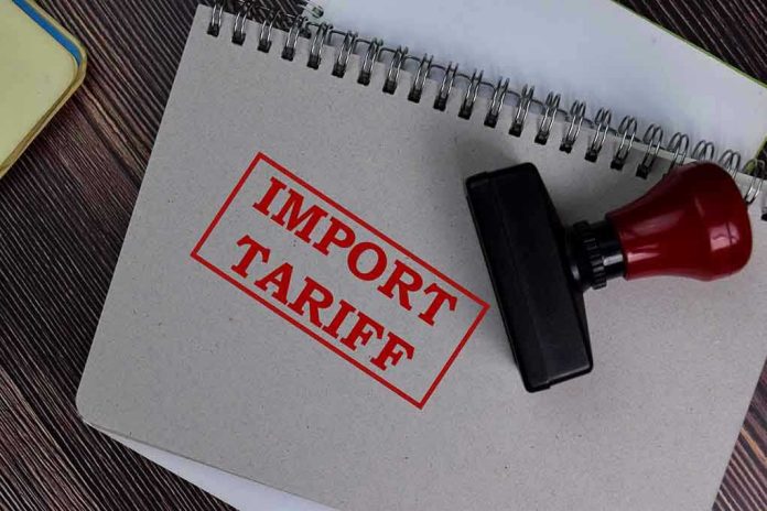 1773748721 Notebook with Import Tariff stamp and rubber stamper.