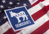 Nazi Tattoo Shocker: Senate Campaign Explodes Democratic Party symbol on American flag background.