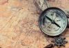 Remarkable Dino Find – Scientists DEAD WRONG! Old compass on a vintage map background.