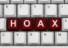 SHOCKING Baby Hoax Fools Entire Family Close-up of a computer keyboard with the word HOAX spelled out in red keys