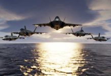 Doomsday Plane VANISHES – No Sign of It Five jets flying low over the ocean at sunset.