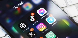 Smartphone showing social media app icons in a folder.