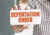 Trump Worker DEPORTED—ICE Blunder Sparks Fury! Hand holding sign with Deportation Order text.