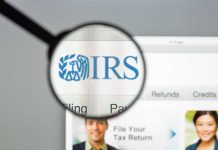 Magnifying glass over IRS website.