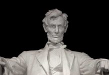 Trump’s Shocking National Mall Revamp Plan Marble statue of Abraham Lincoln seated with a serious expression