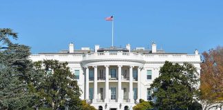 The White House with the American flag flying in front