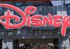 HORRIFYING Disney Crisis — Four Dead, Zero Answers Bright red Disney logo displayed on a storefront window