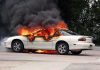 320,000 Cars in Danger: Fire Risk Alert! A white car engulfed in flames with thick black smoke rising
