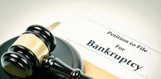 Gavel on bankruptcy petition document.