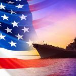 TRUMP UNLEASHES Battleship Revival – Navy SHOCKED American flag overlaying warship at sunset.