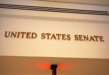 Senator Receives Pipe Bomb at Her Home! Sign displaying United States Senate in a government building
