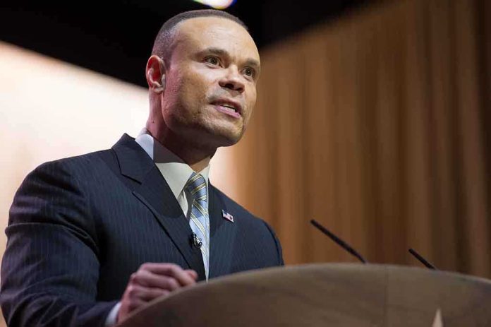 A man in a suit speaking at a podium during a conference