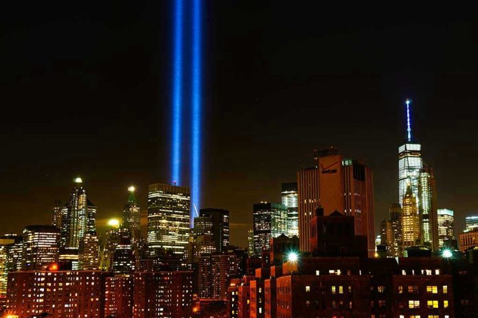 New York City skyline at night with memorial lights.