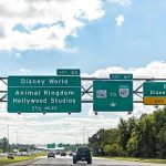 Highway exit signs for Disney World attractions.