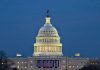MIDNIGHT Shutdown Begins – Congress Missing In Action U.S. Capitol building illuminated at dusk.