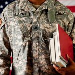 Army Commander FIRED – Rare Military Dismissal A soldier in a U.S. Army uniform holding books in front of an American flag