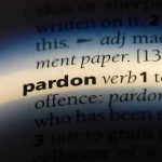 Trump Pardons 5 NFL Stars – Wipes Slate Clean! The word pardon highlighted in a dictionary.