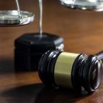 Obama Judge RELEASES 4 Child Predators – Hours After ARREST! Gavel and scales of justice on wooden table.