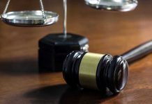 Obama Judge RELEASES 4 Child Predators – Hours After ARREST! Gavel and scales of justice on wooden table.