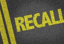 Yellow RECALL text on asphalt background.