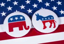 Dems Flip Seat In Huge Upset As Blue Wave Crashes GOP Republican elephant and Democrat donkey on American flag.