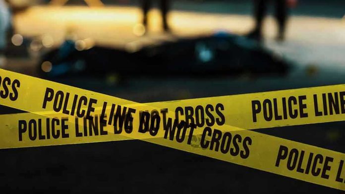 Police tape marking a crime scene at night.