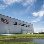 SpaceX IPO Set for June 12 — $1.75 Trillion Price Tag SpaceX building with American flag and launch pad.