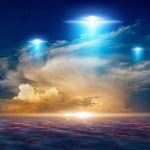 UFO Videos Withheld: Harvard Astrophysicist Points Finger Glowing lights above dramatic sunset clouds.
