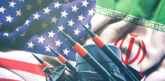 Iran and USA flags with missile launcher.