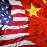 POWER FLIP: Trump Begs China for Critical Materials United States flag merged with China flag.