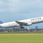 United Jet Scrapes Highway – How Did It Happen? United airplane taking off from a runway.