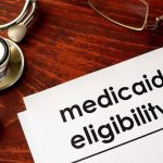 Antidepressants’ SHOCKING Link to Sudden Death Risk Stethoscope pen document about Medicaid eligibility on table