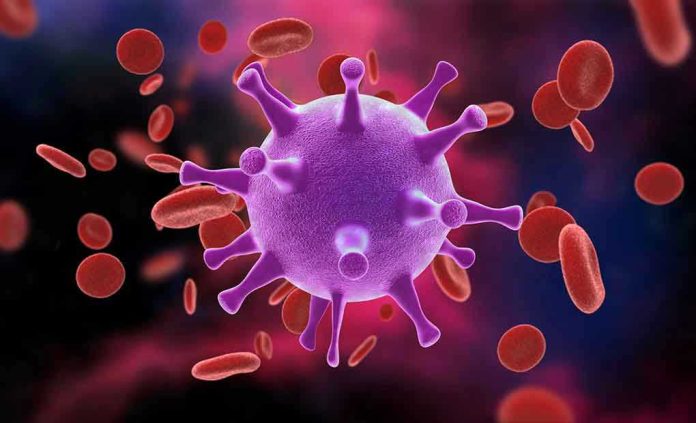 766978168 Virus surrounded by red blood cells.