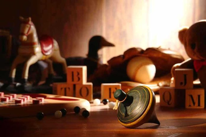 shutterstock_105363350 A wooden spinning top surrounded by vintage toys and colorful blocks
