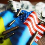 Flags, bullet casings, and dollar bills on table.