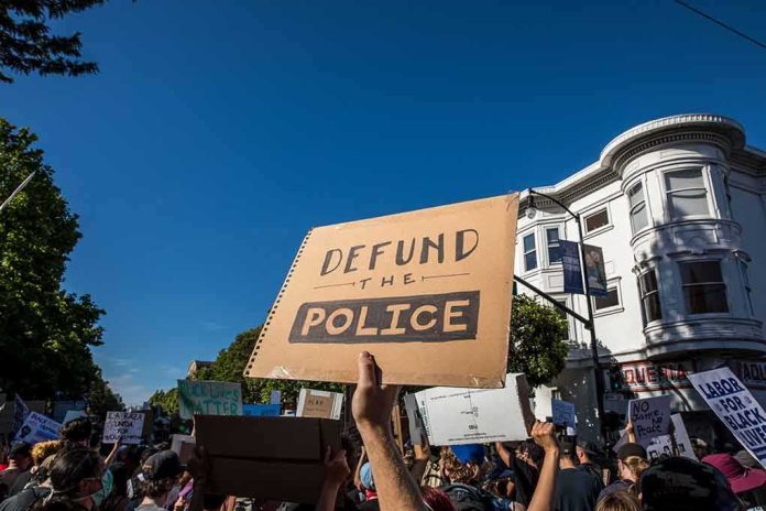 shutterstock_1749068321 protesters holding signs at a street demonstration
