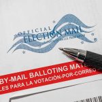Official election mail envelope with pen